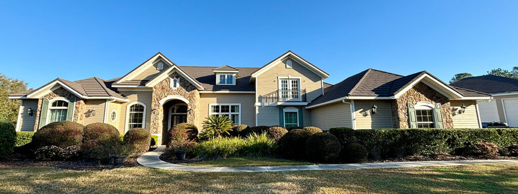 Rustic style home with dark shingles